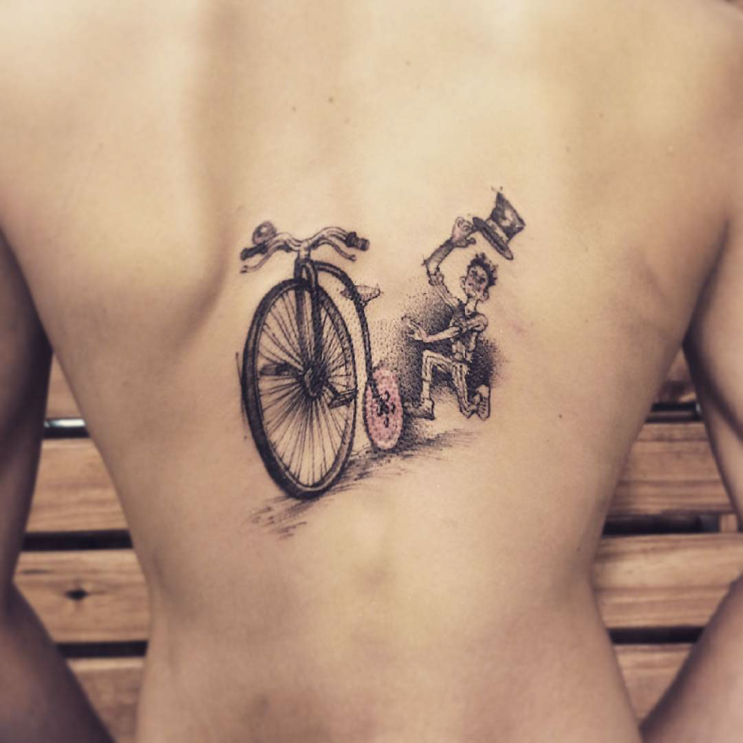 bicycle tattoo on back