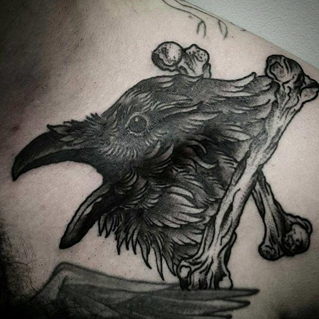 Crossed Bones Bird Tattoo