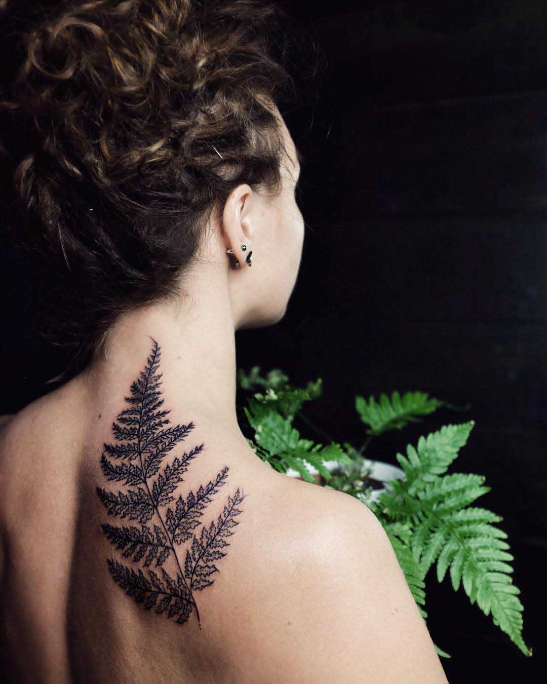fern tattoo on back