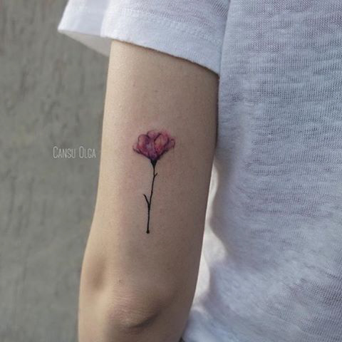 small flower watercolor tattoo