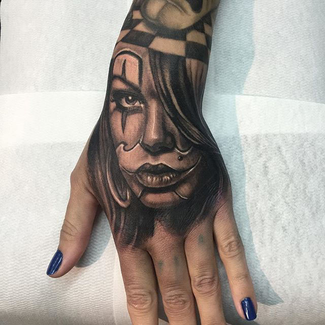 hand tattoo Chicano girl