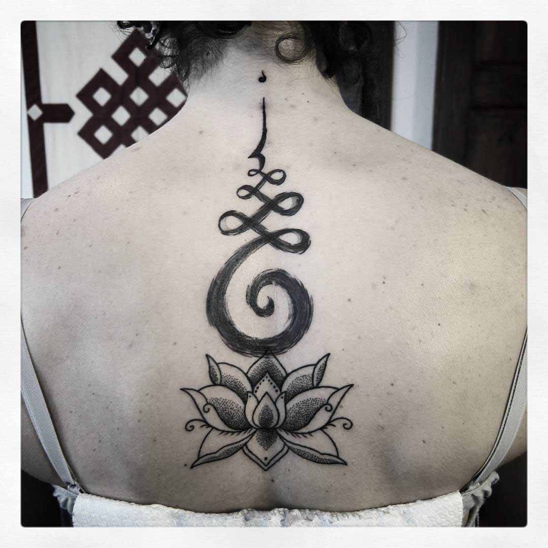 hindu lotus tattoo on back