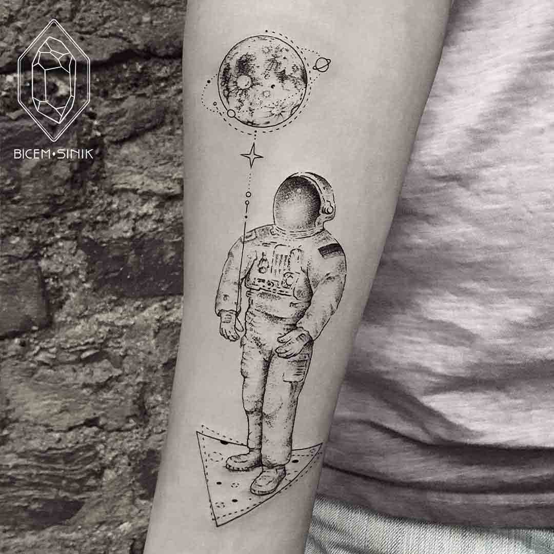 astronaut with moon tattoo