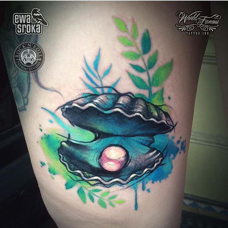sea shell with pearl tattoo