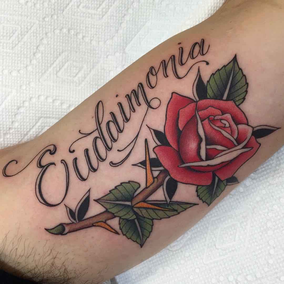neo-traditional rose lettering tattoo