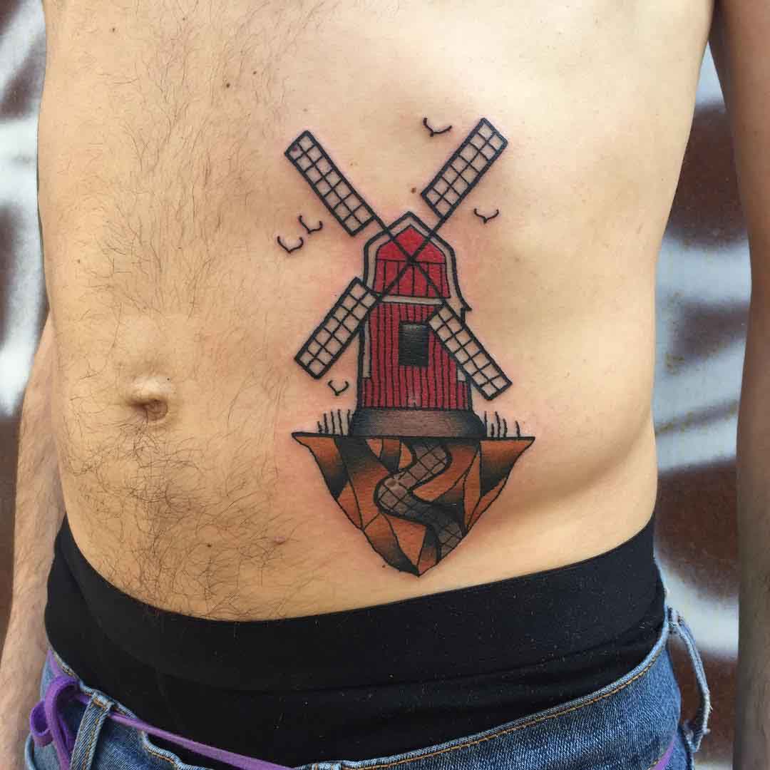 stomach windmill tattoo