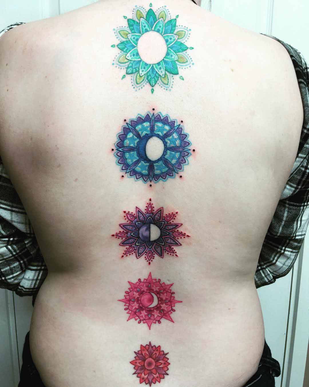Flowers Moon Phases Tattoo on Spine by jaigilchristtattoo