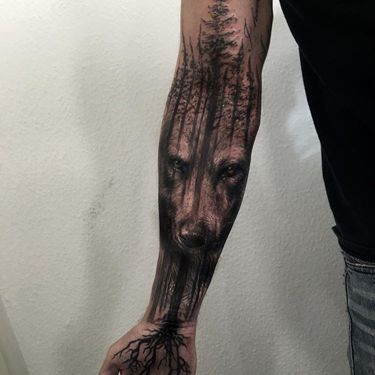 wolf face and forest tattoo sleeve