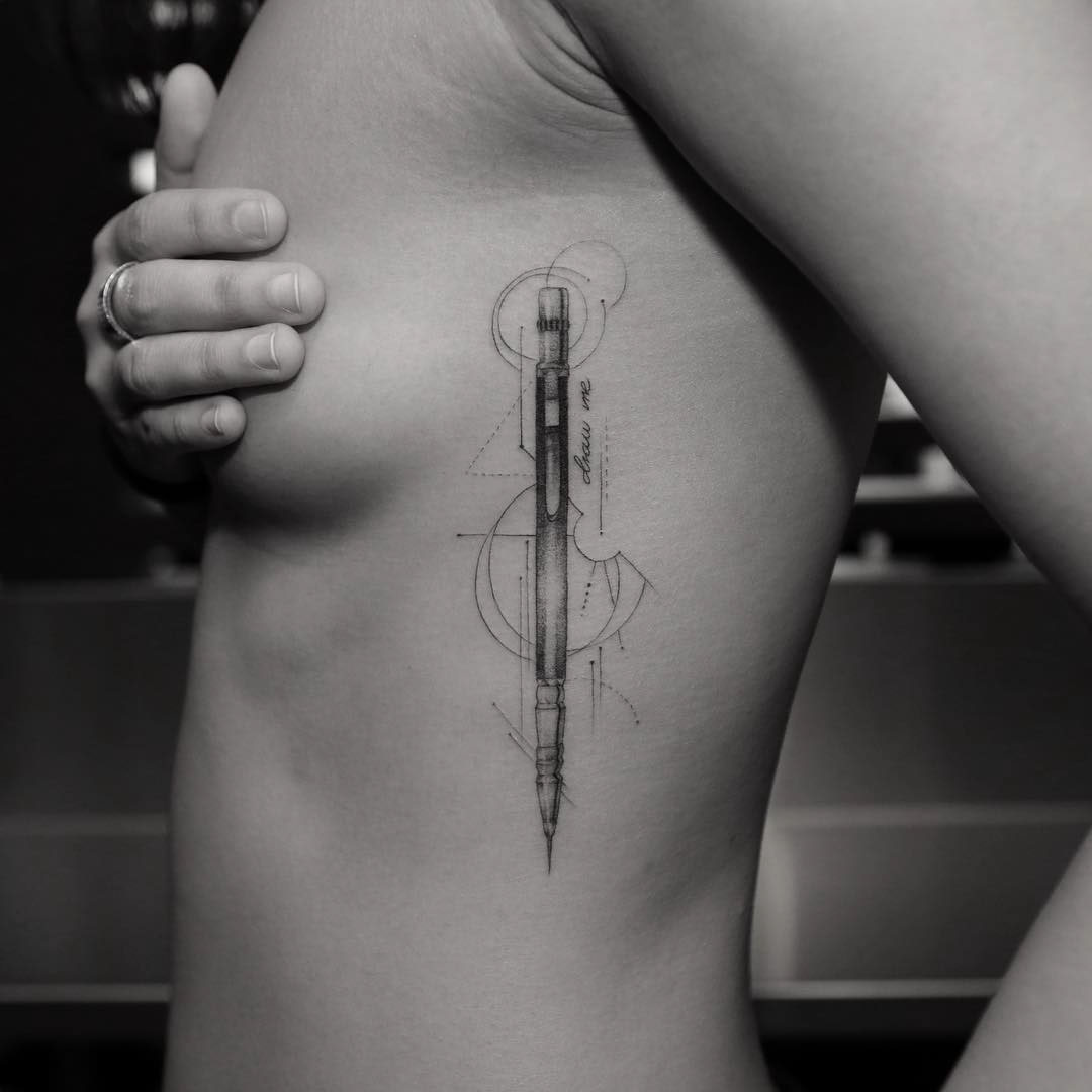 rib tattoo pen tattoo geometrical