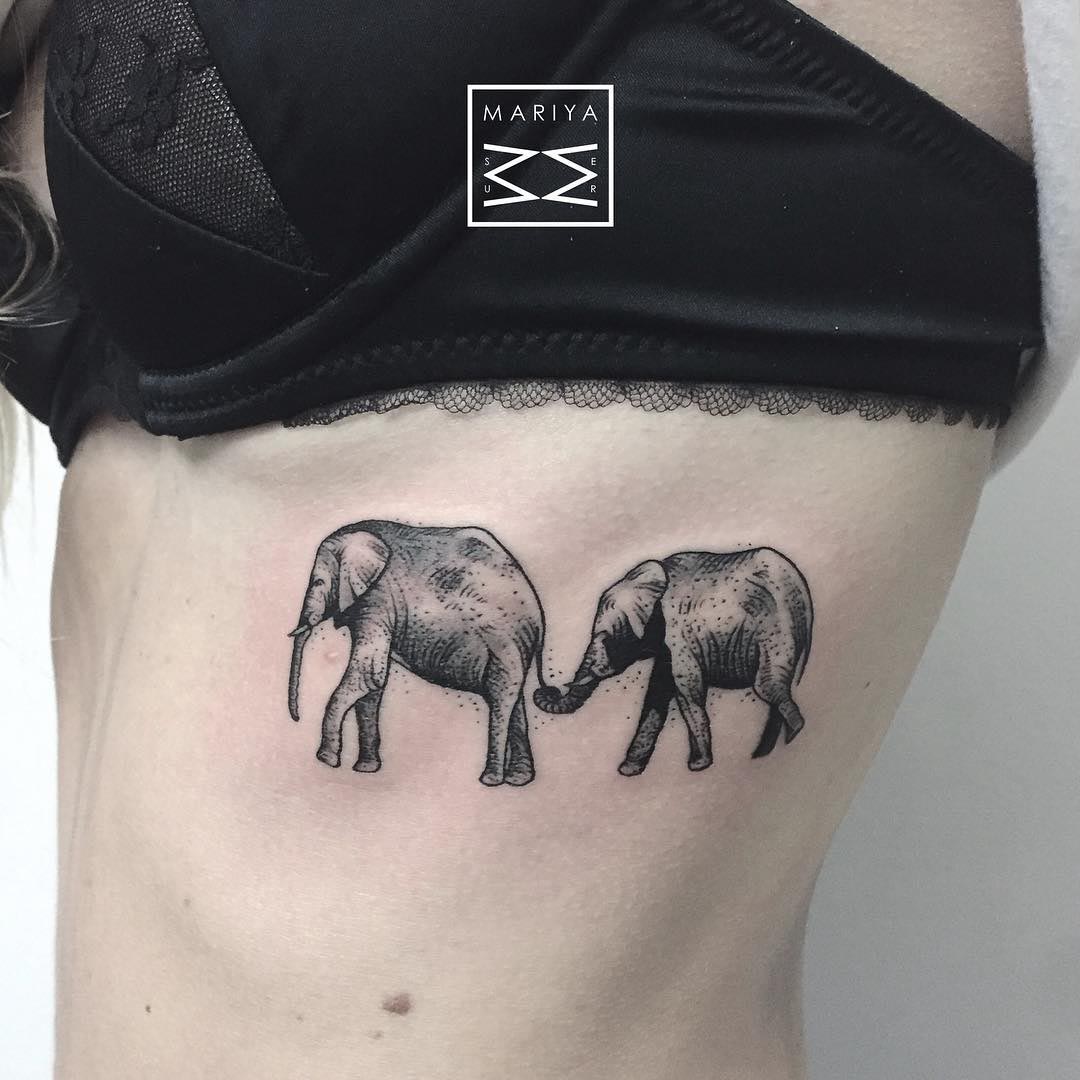 rib tattoo elephants