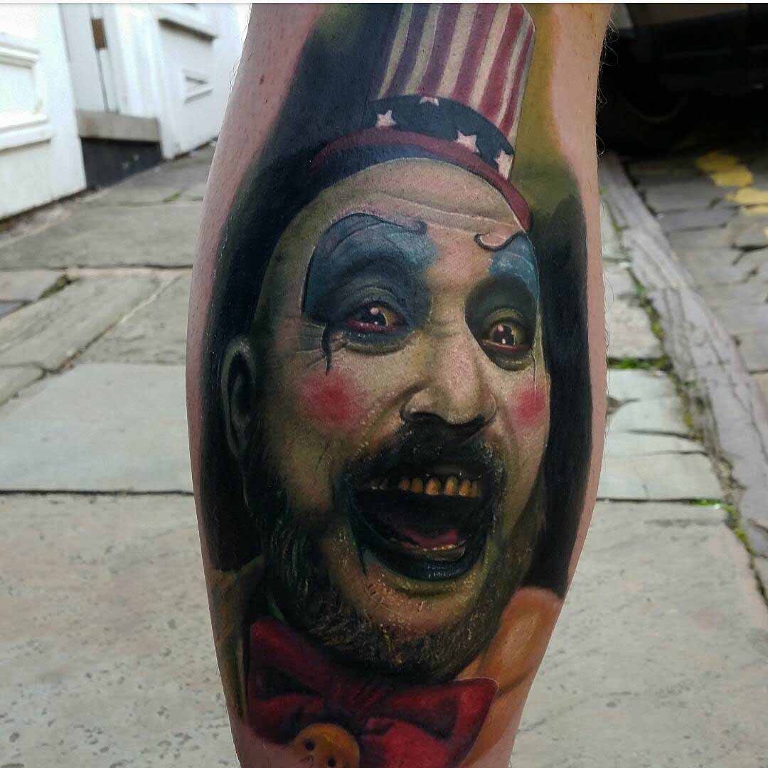 realistic clown tattoo on leg