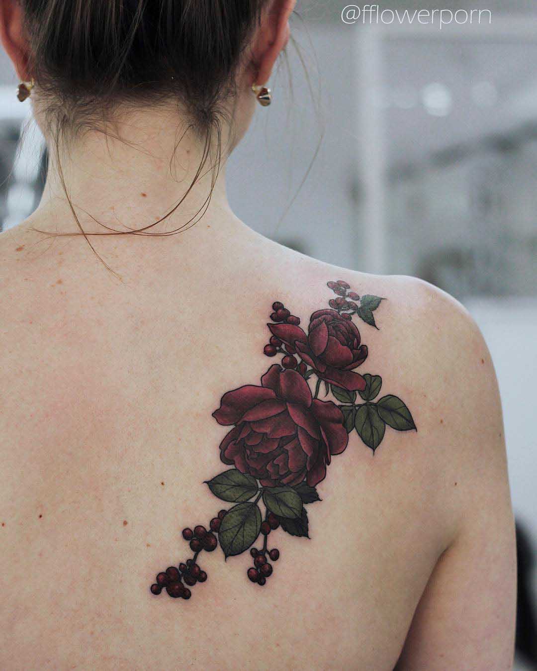 dark red roses tattoo on shoulder blade