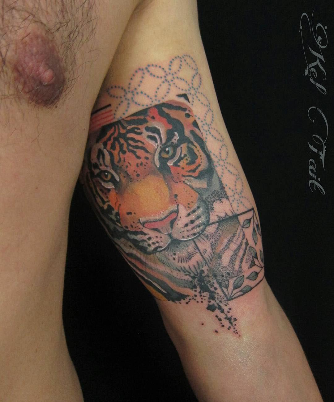 inner bicep tattoo tiger