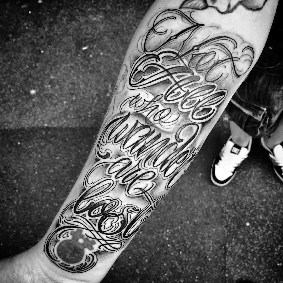 chicano tattoo lettering on arm