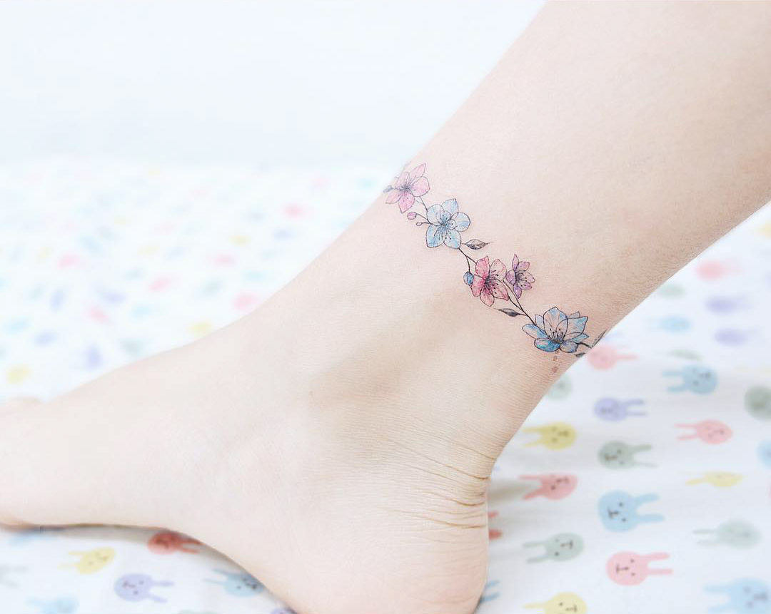 flower bracelet tattoo on ankle