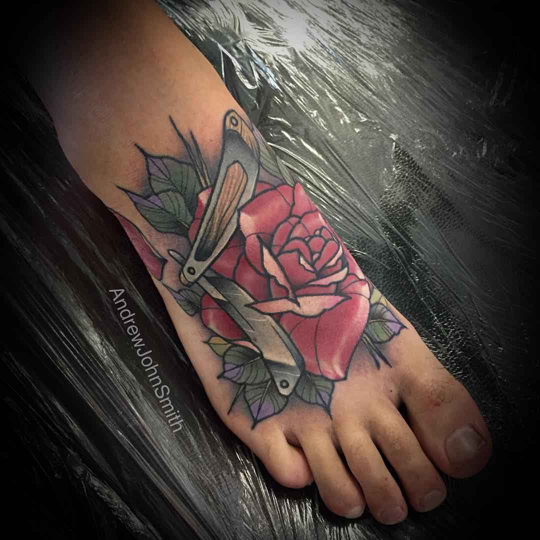 razor and rose tattoo on foot