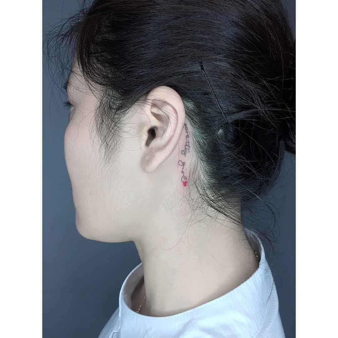 lettering tattoo behind ear