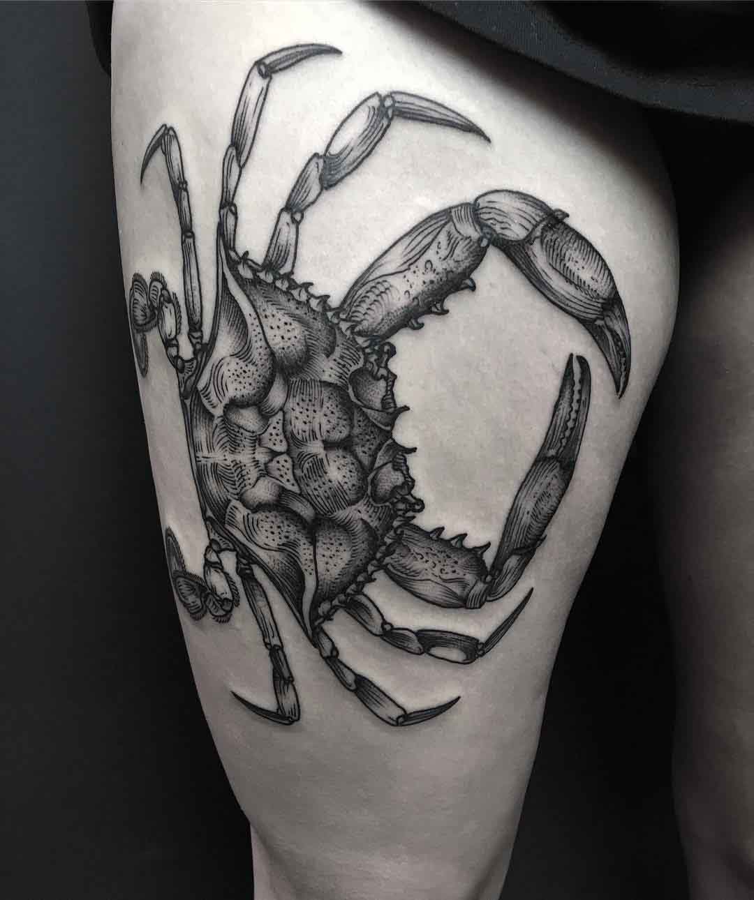 crab tattoo on thigh