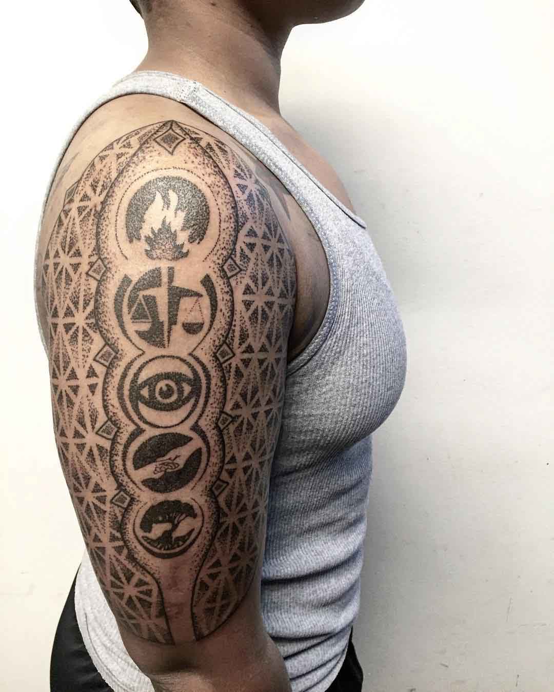 divergent faction symbols tattoo dotwork on shoulder