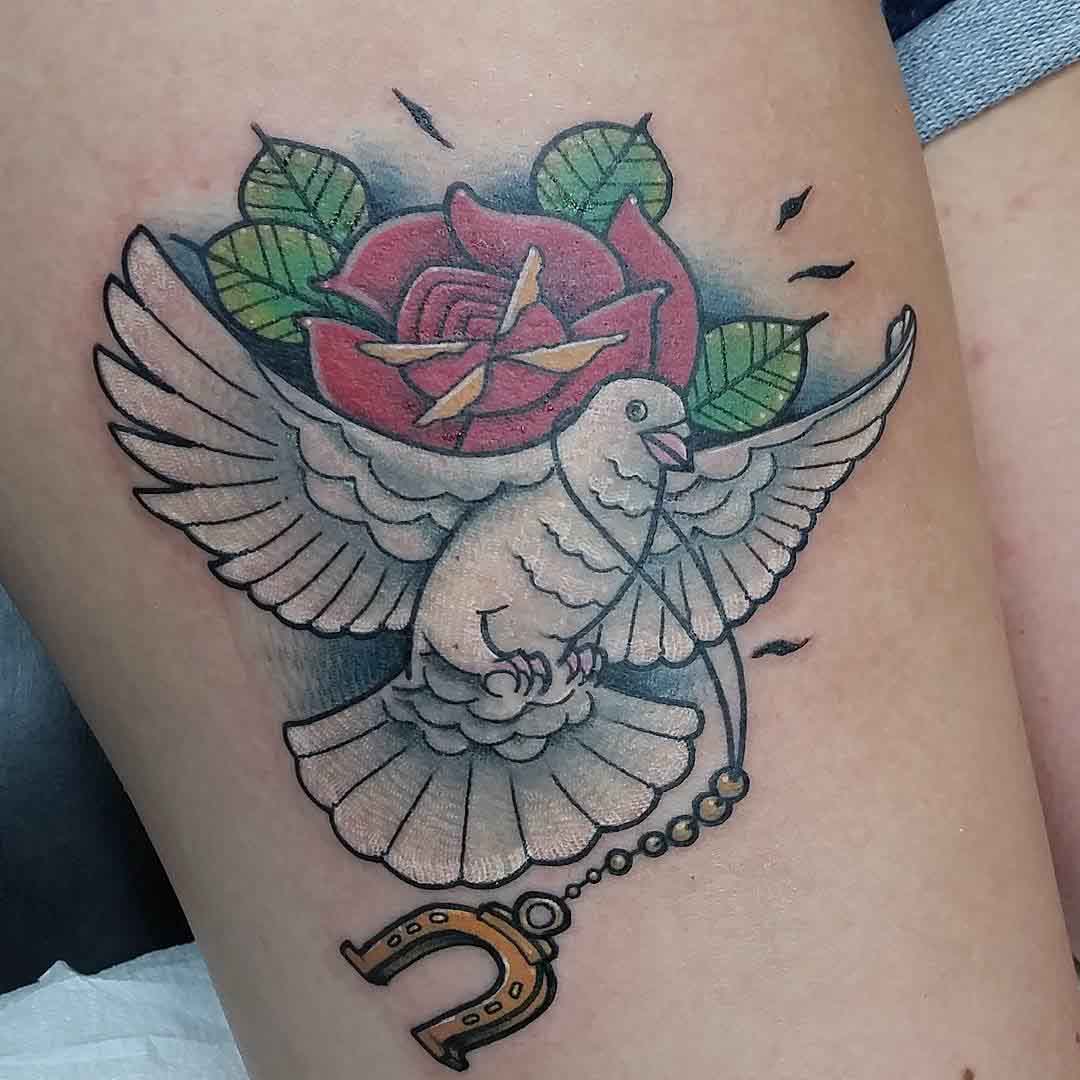 rose dove and horseshoe tattoo