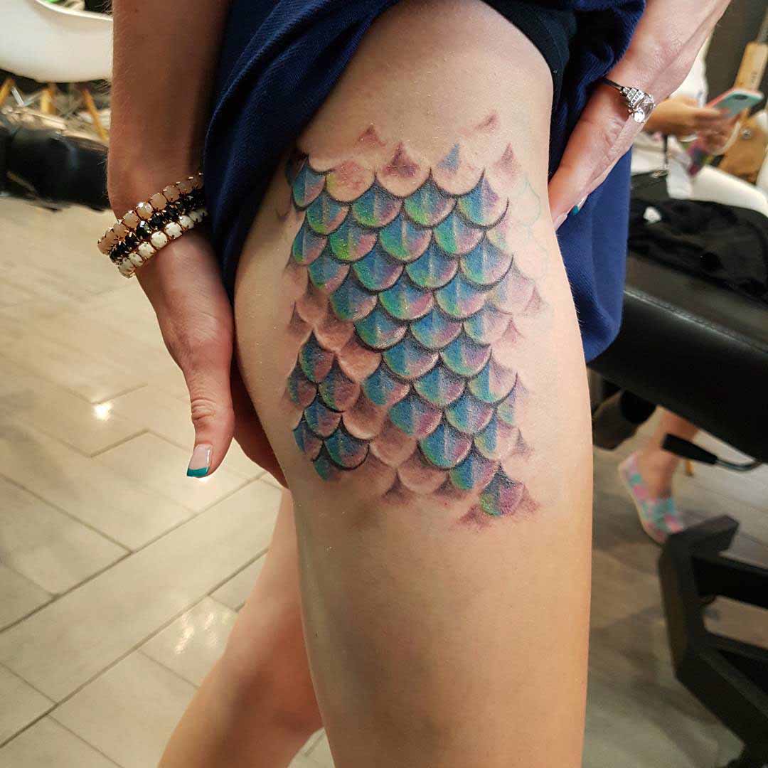 Tattoo with fish scales and Japanese elements in tribal style
