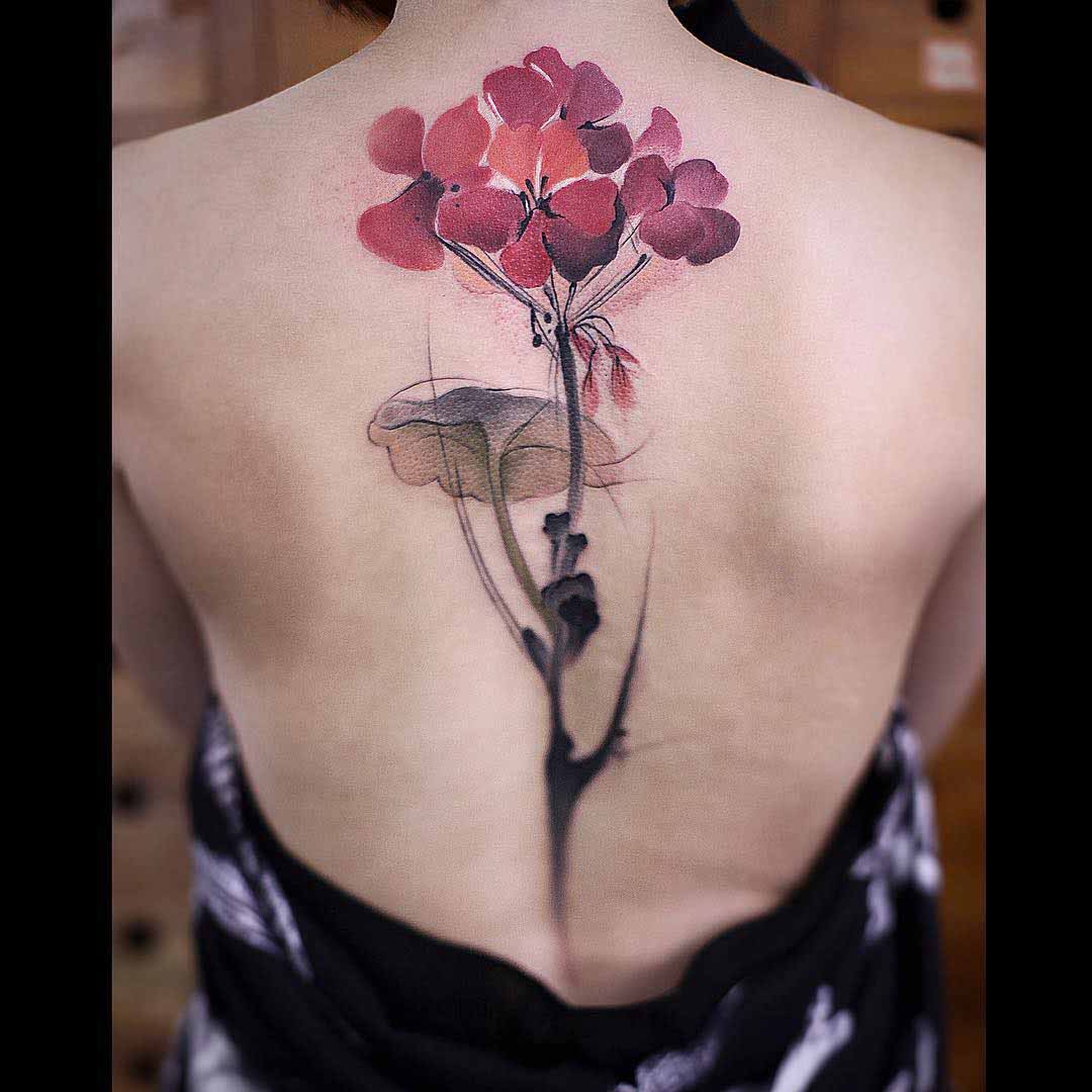 back watercolor floral tattoo