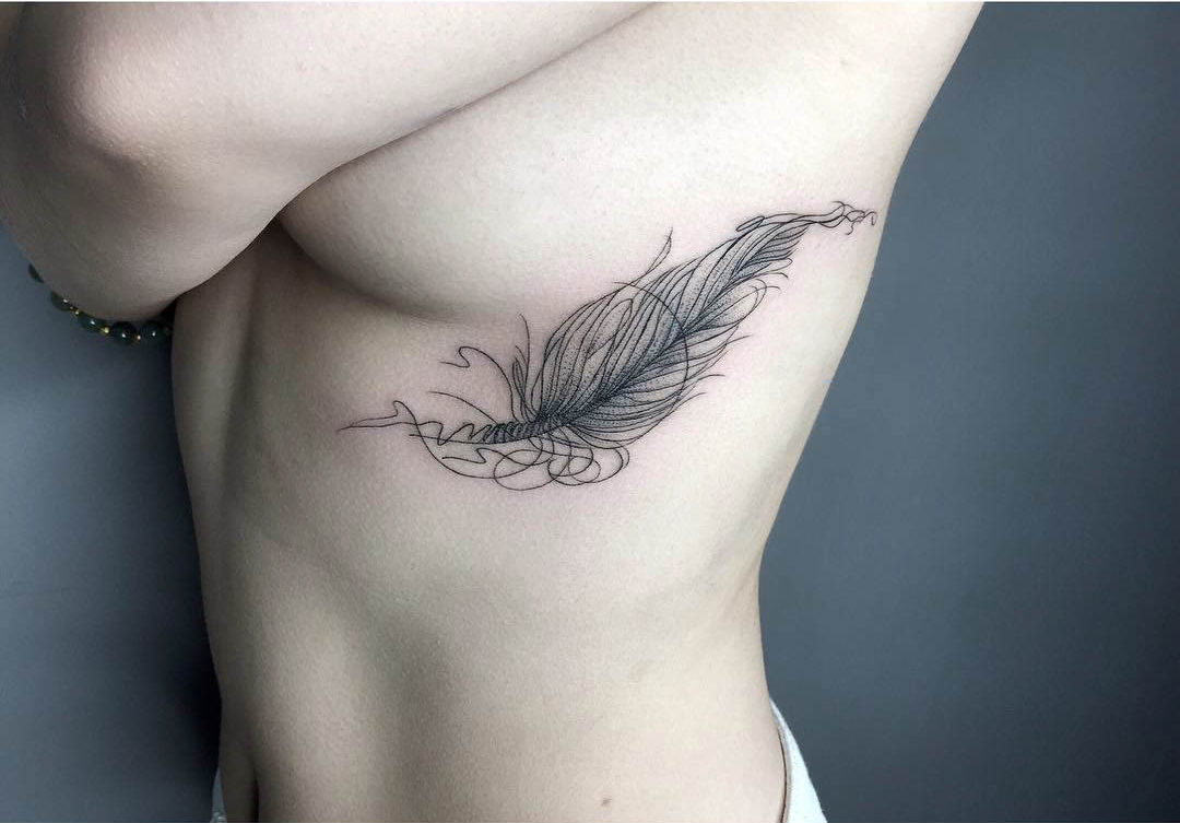 rib tattoo feather for girls