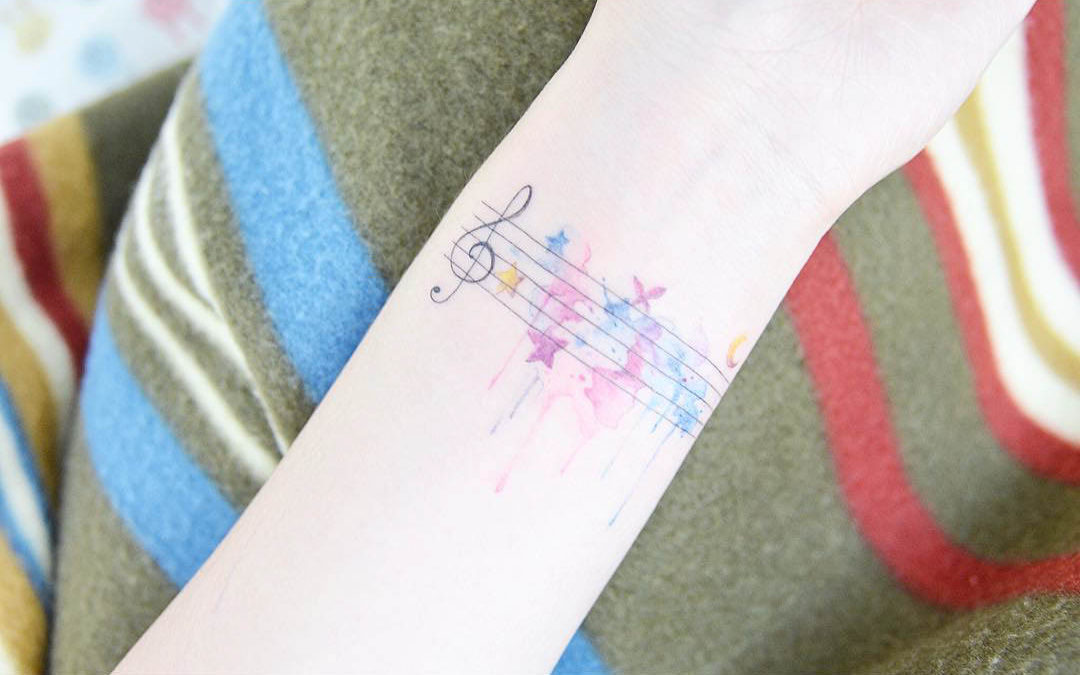 soft wrist tattoo musical themed