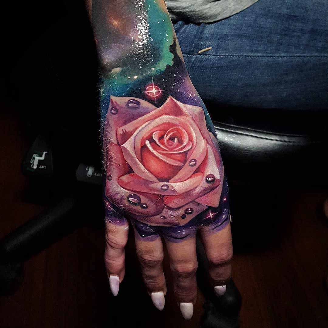 realistic pink rose tattoo on hand