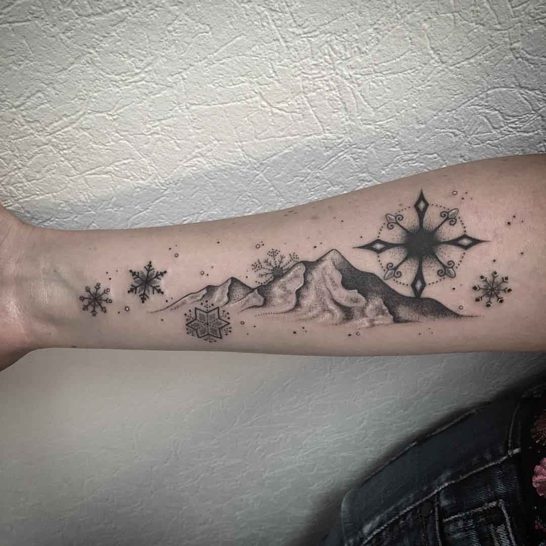 snowy mountain tattoo on arm