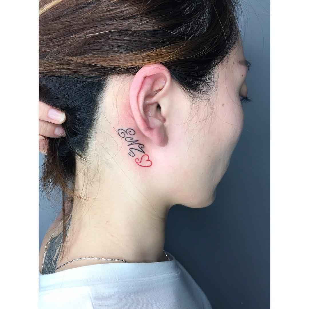 feminine tattoo behind ear