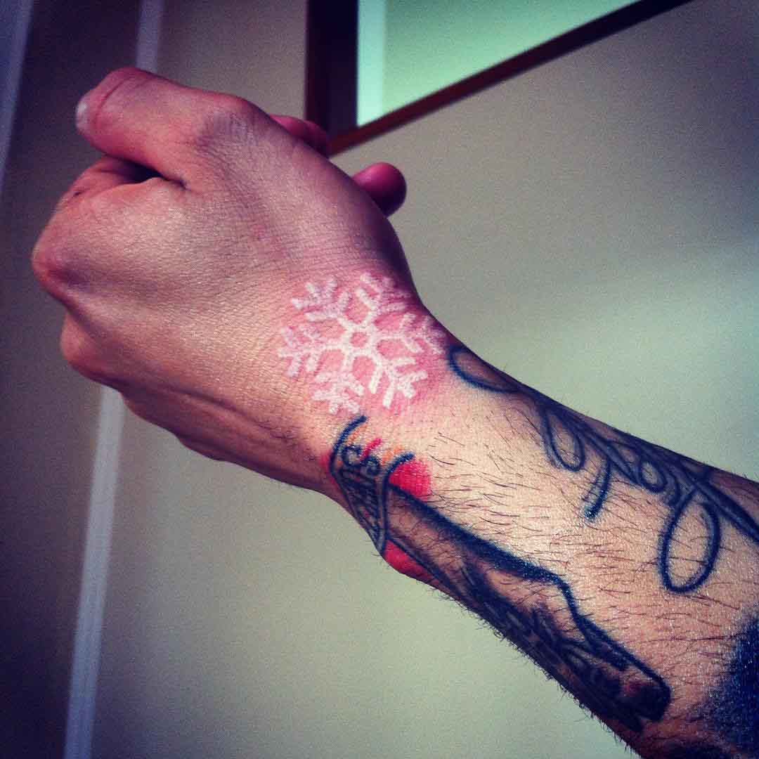 White snowflake tattoo. A little red since its fresh. By Philip at  Allegiance Ink Tattoo in Augusta, GA