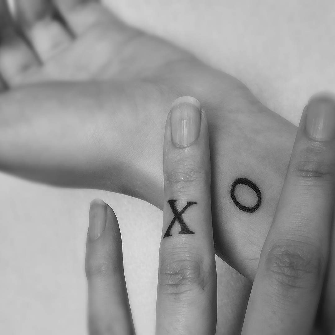 X O Tattoos for Sisters on Wrist and Finger