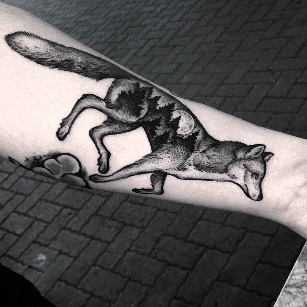 arm tattoo fox running