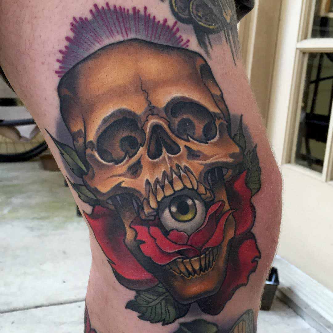 neo-traditional skull tattoo with eye