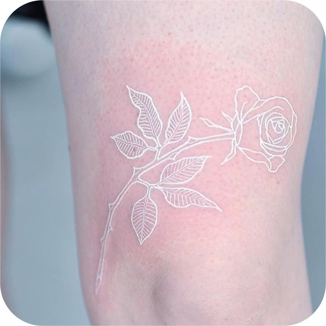 white ink rose tattoo