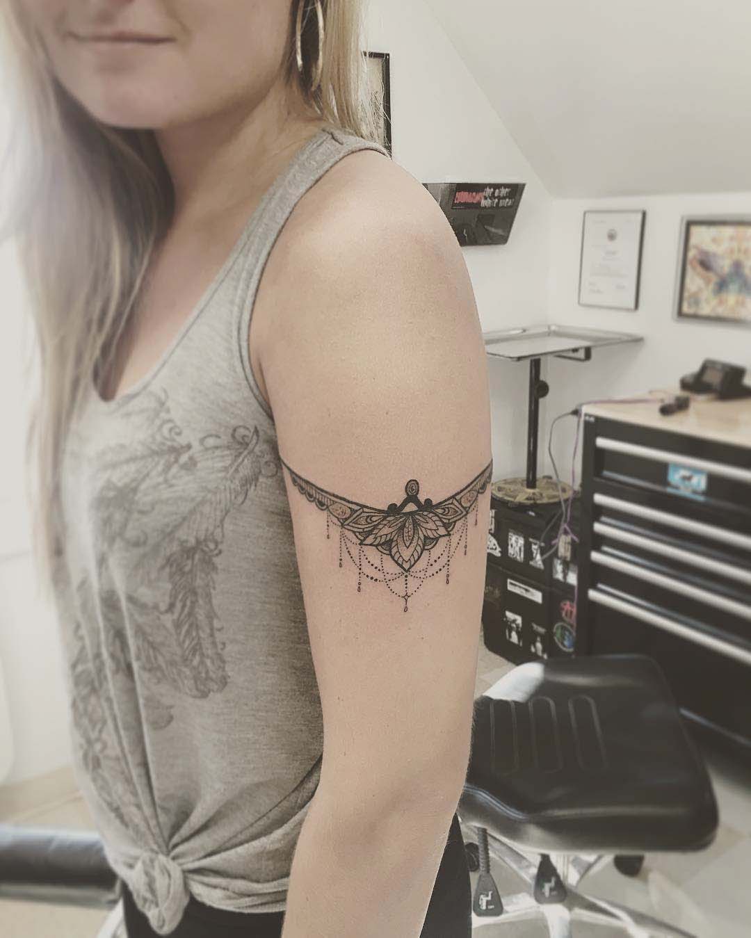armband tattoo around bicep girl