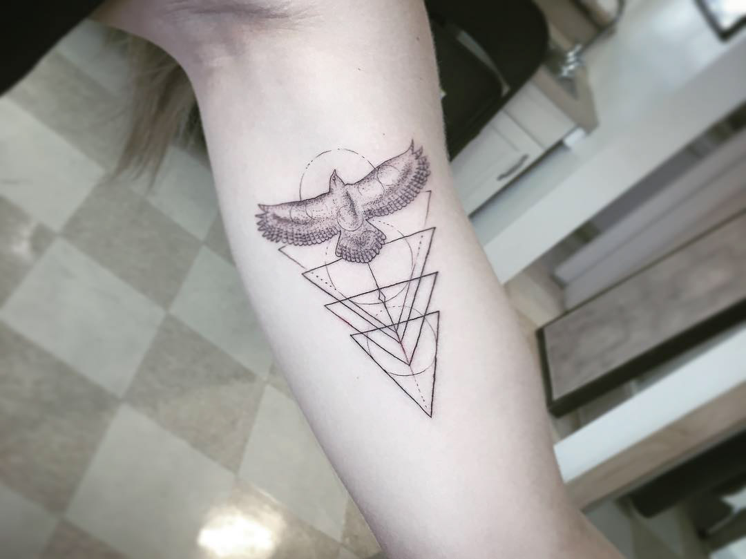 geometrical bicep tattoo bird