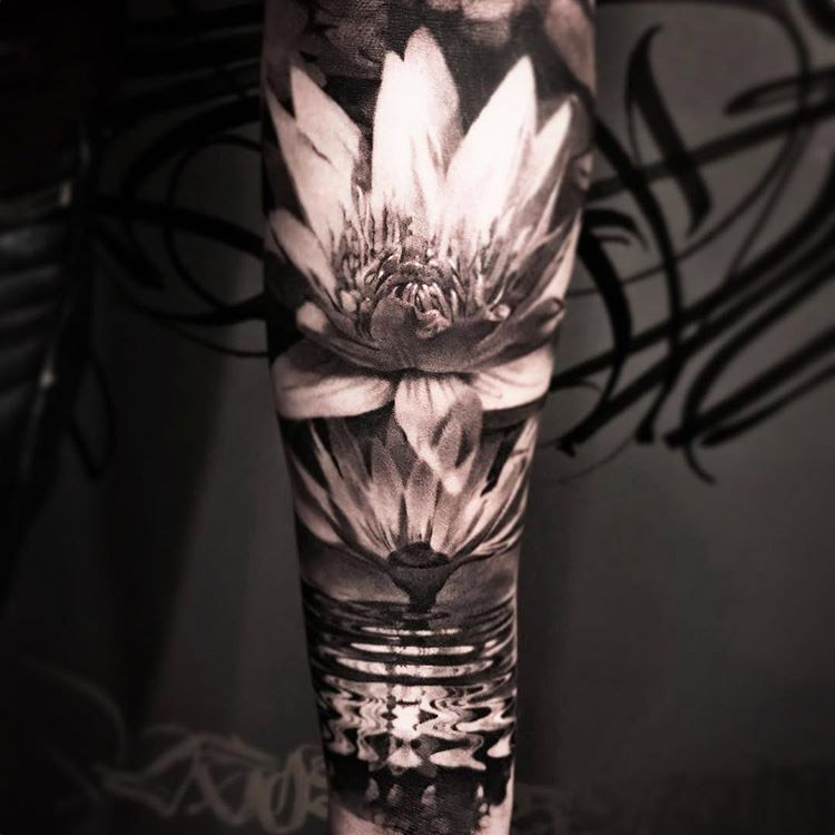 Lotus flower tattoo eD sleeve on arm