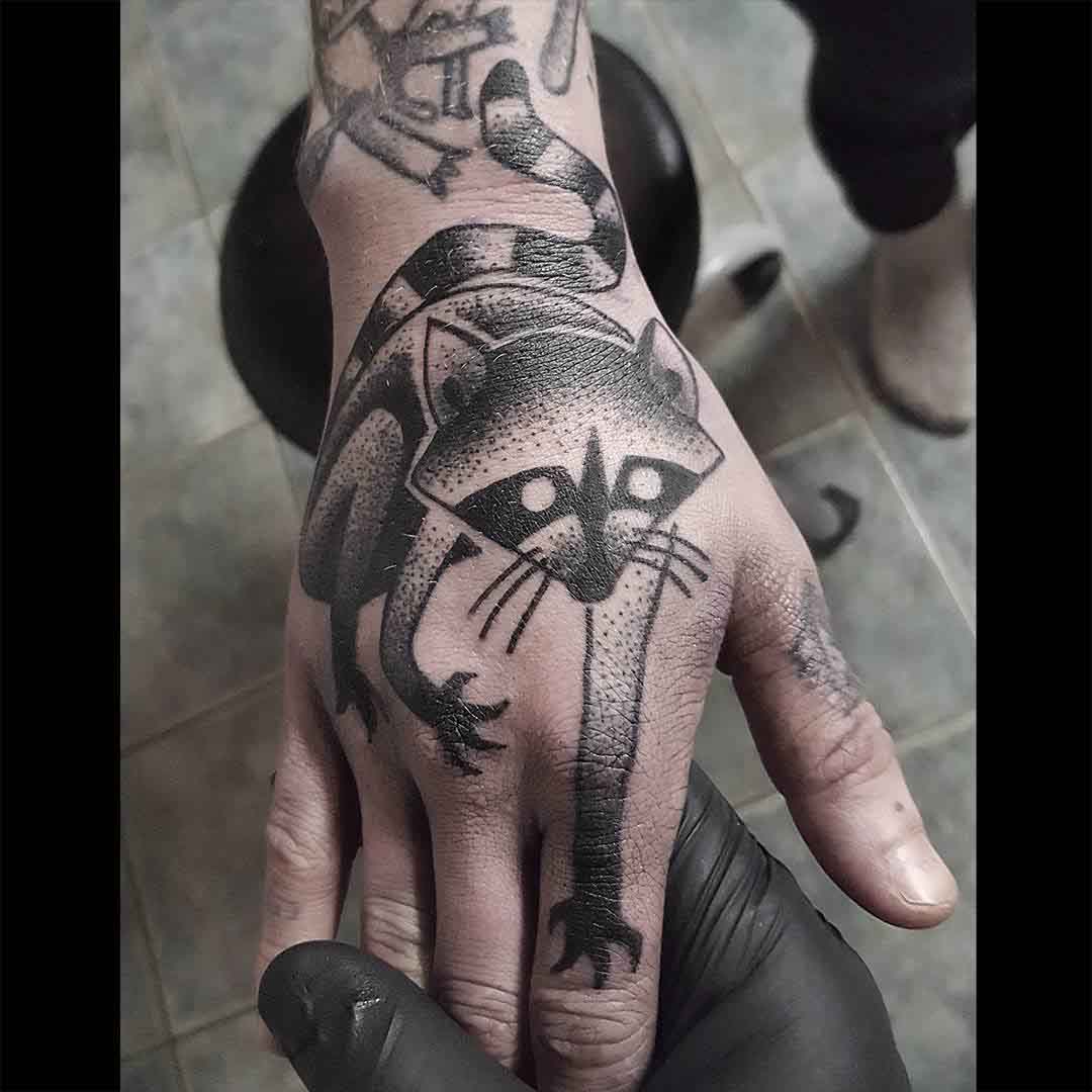 hand tattoo racoon dotwork style