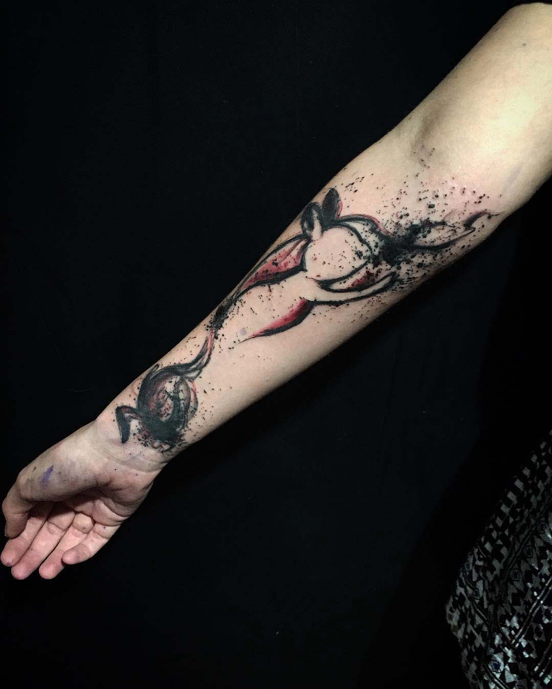 watercolor tattoo on forearm