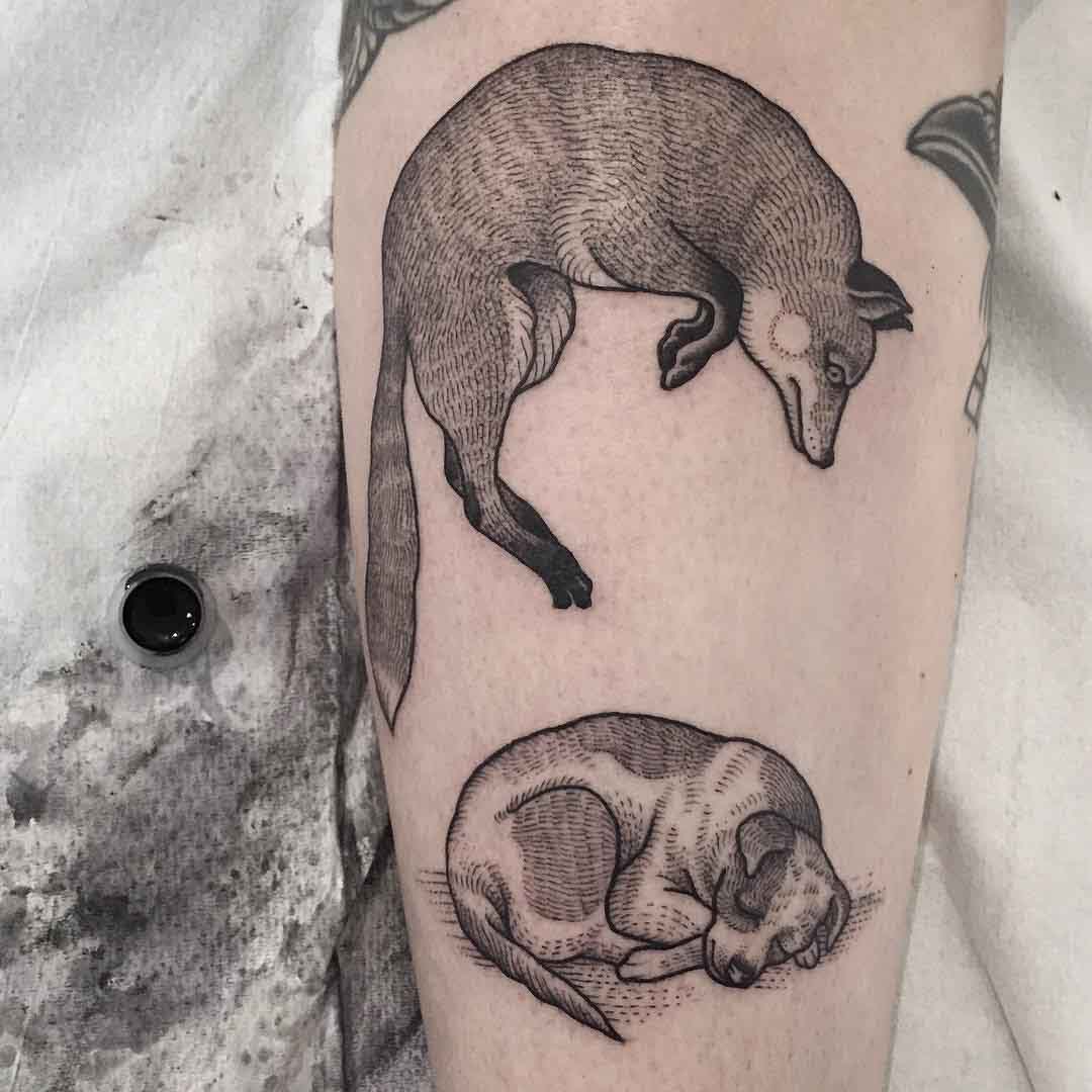 fox and hound tattoo on arm