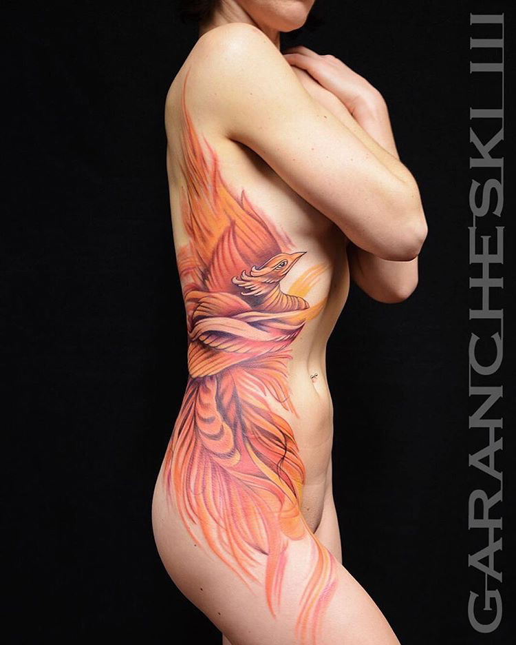 gird phoenix tattoo on side