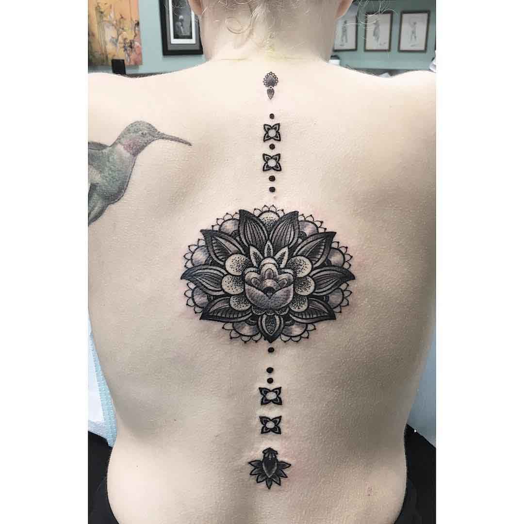 lotus tattoo on spine
