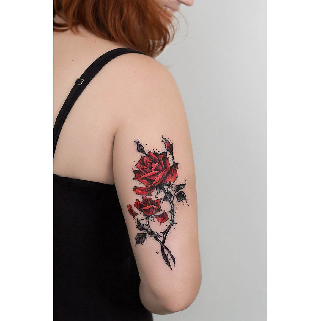 back arm tattoo red rose