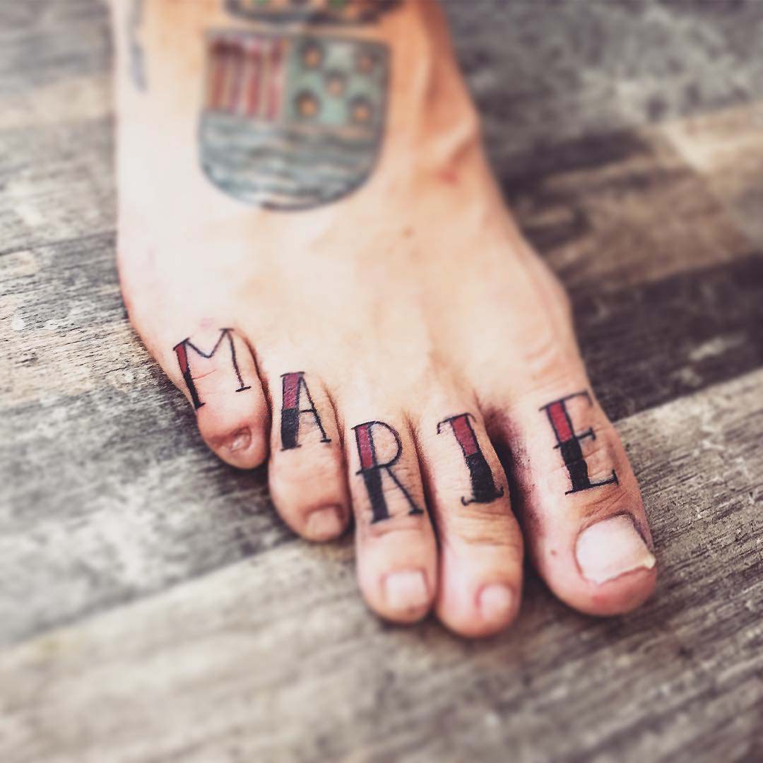 Marie Name Tattoo on Toes by Black Cat Ink Tattoo