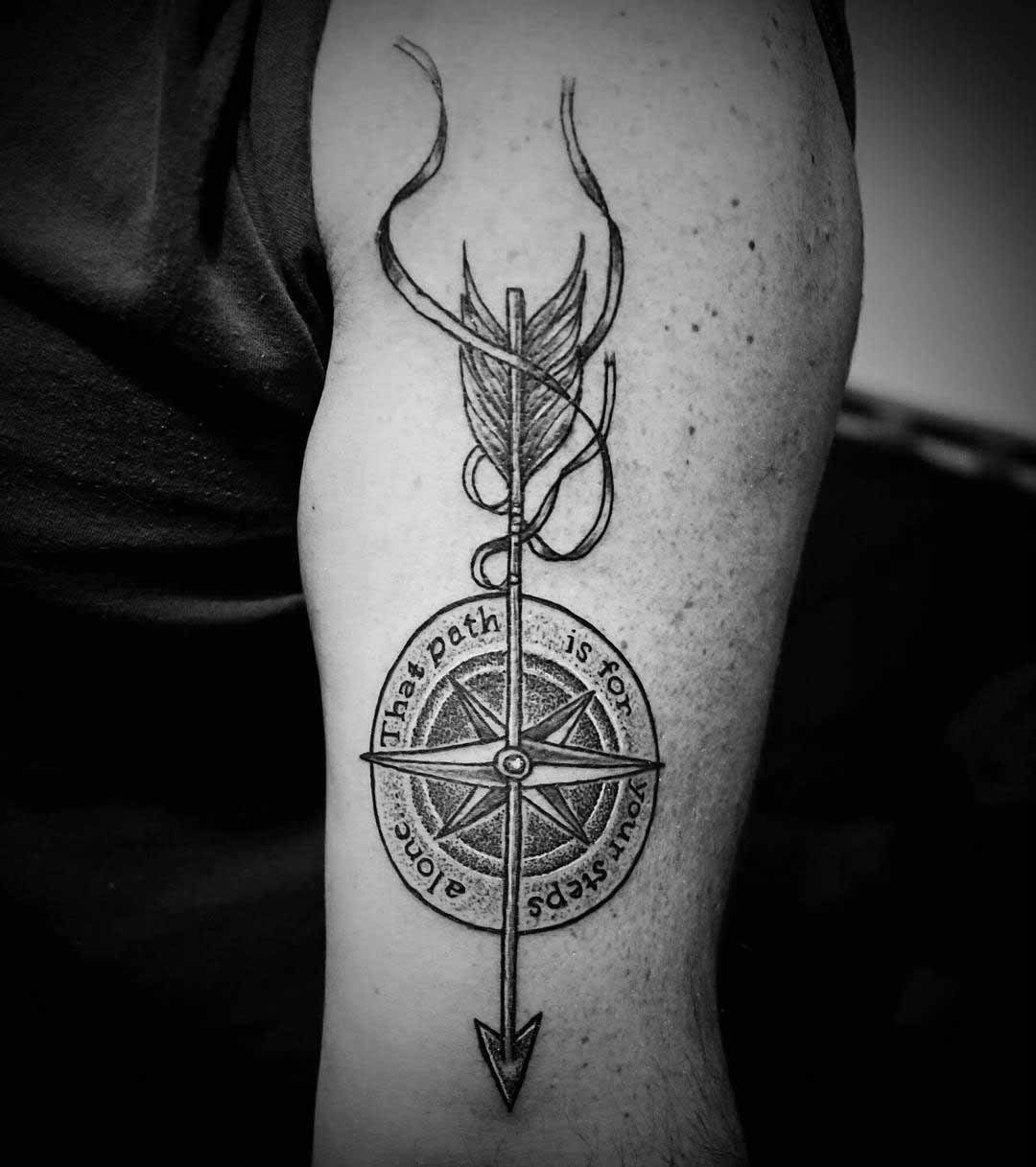 arrow and lettering compass tattoo