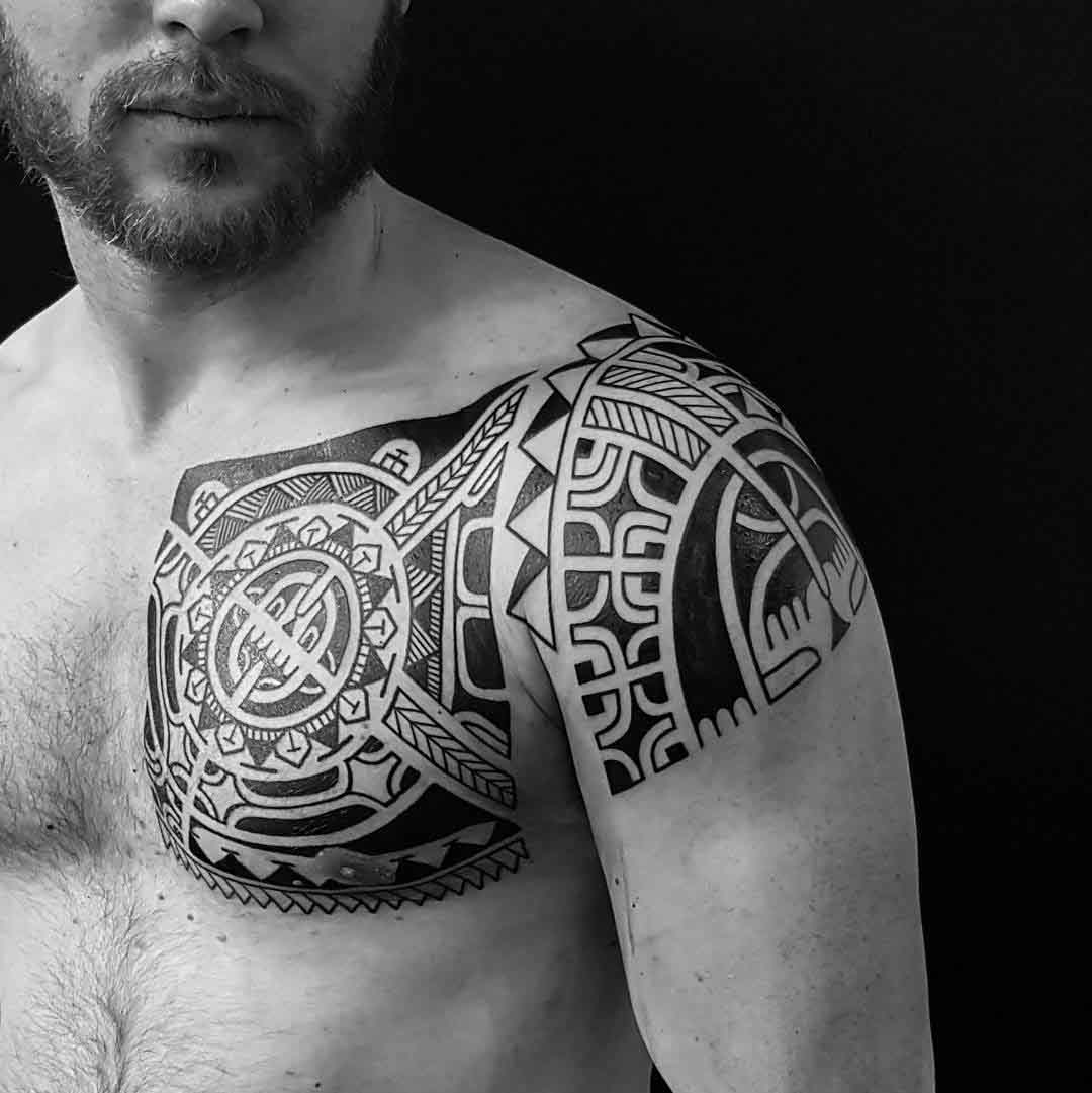 chest to shoulder polynesian tattoo