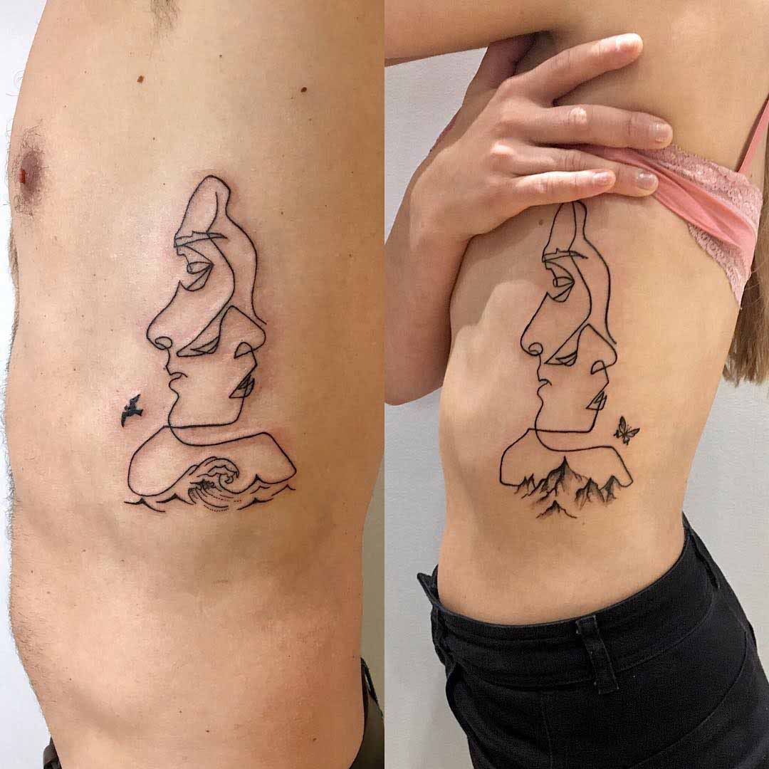 sea and mountain oulines faces couple tattoos on ribs