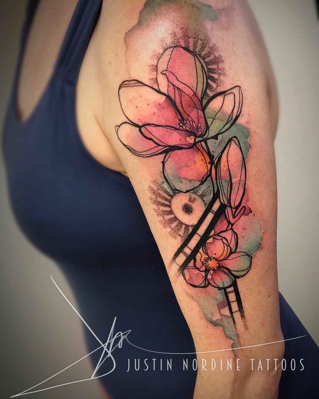 watercolor mgnolia tattoo on shoulder